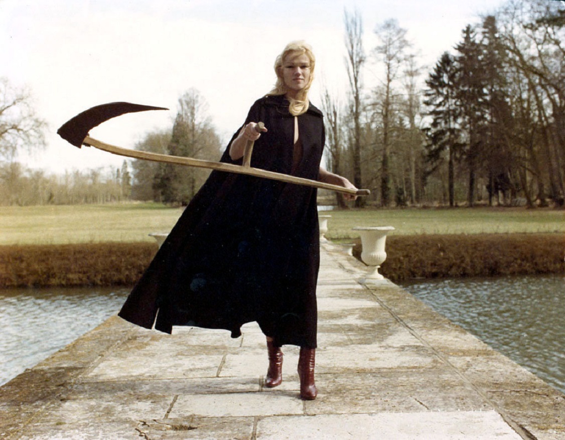 A scythe-wielding Brigitte Lahaie in Fascination (1979)