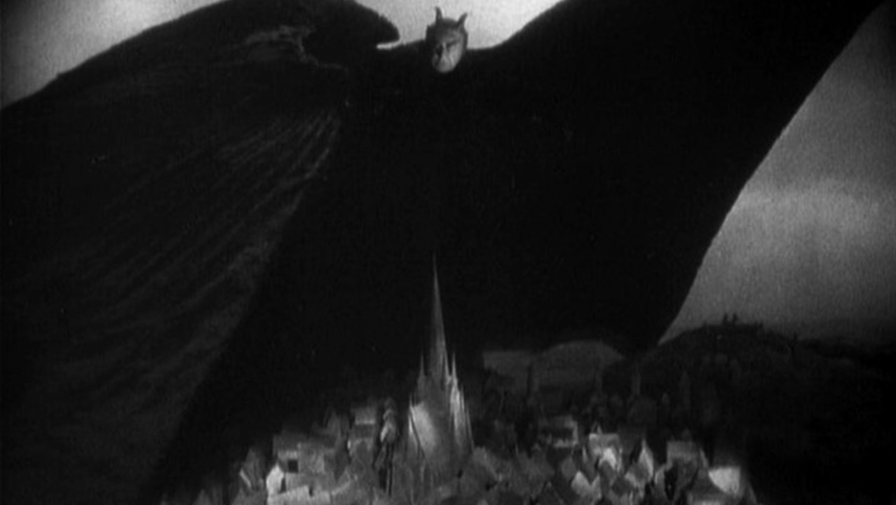 Mephisto's shadow stretches over the town in Faust (1926)