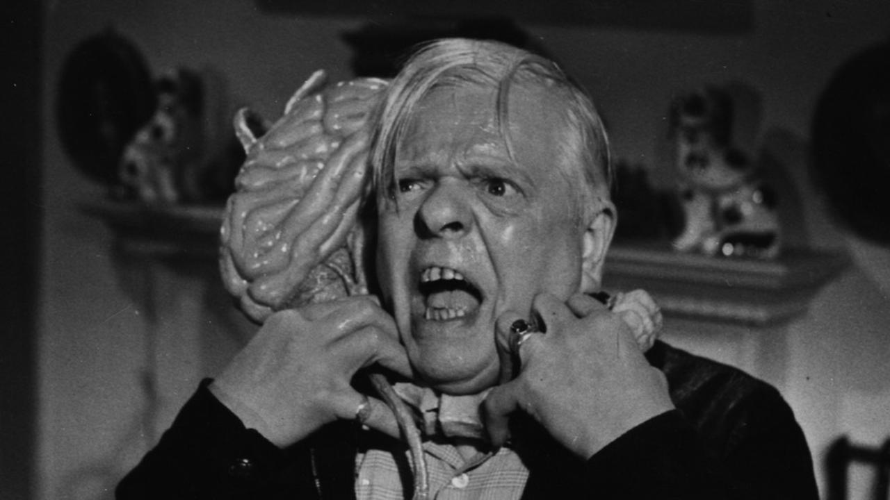 Launce Maraschal under attack by a hopping brain in Fiend Without a Face (1958)