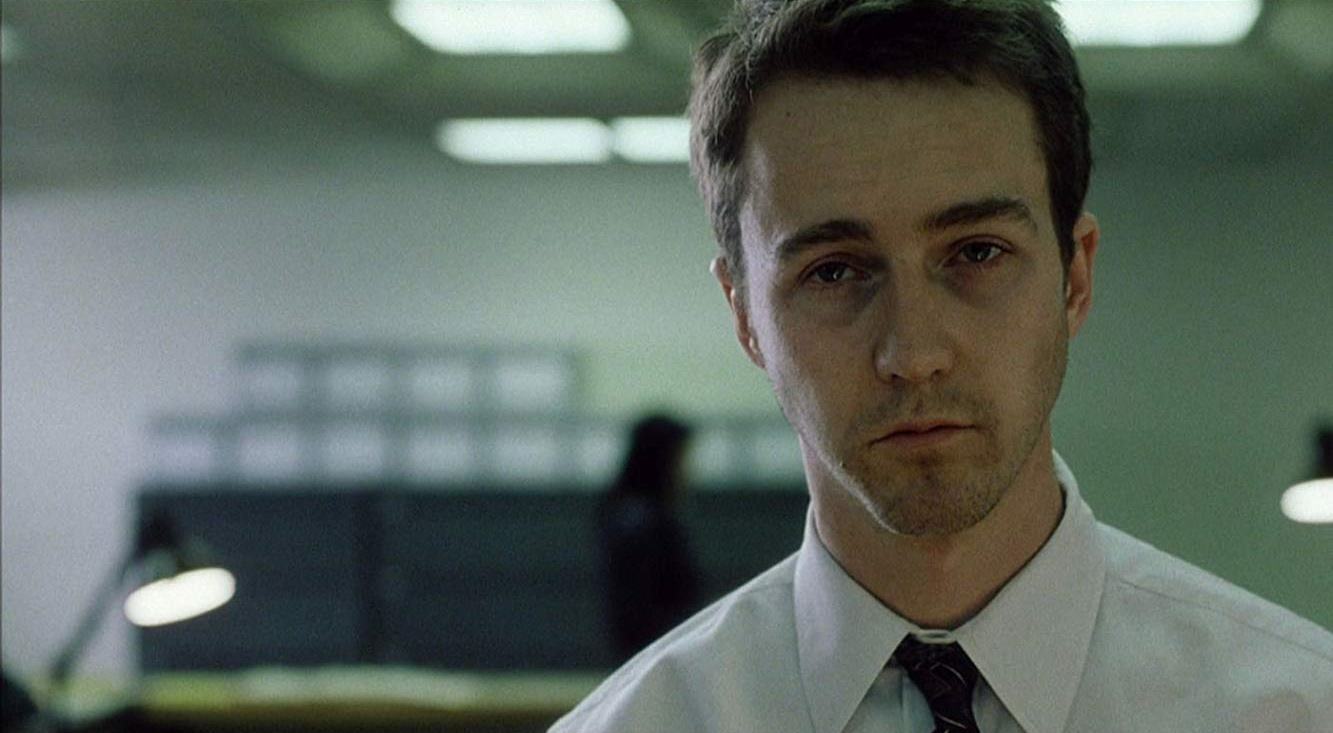 Edward Norton trapped in a meaningless consumer lifestyle in Fight Club (1999)