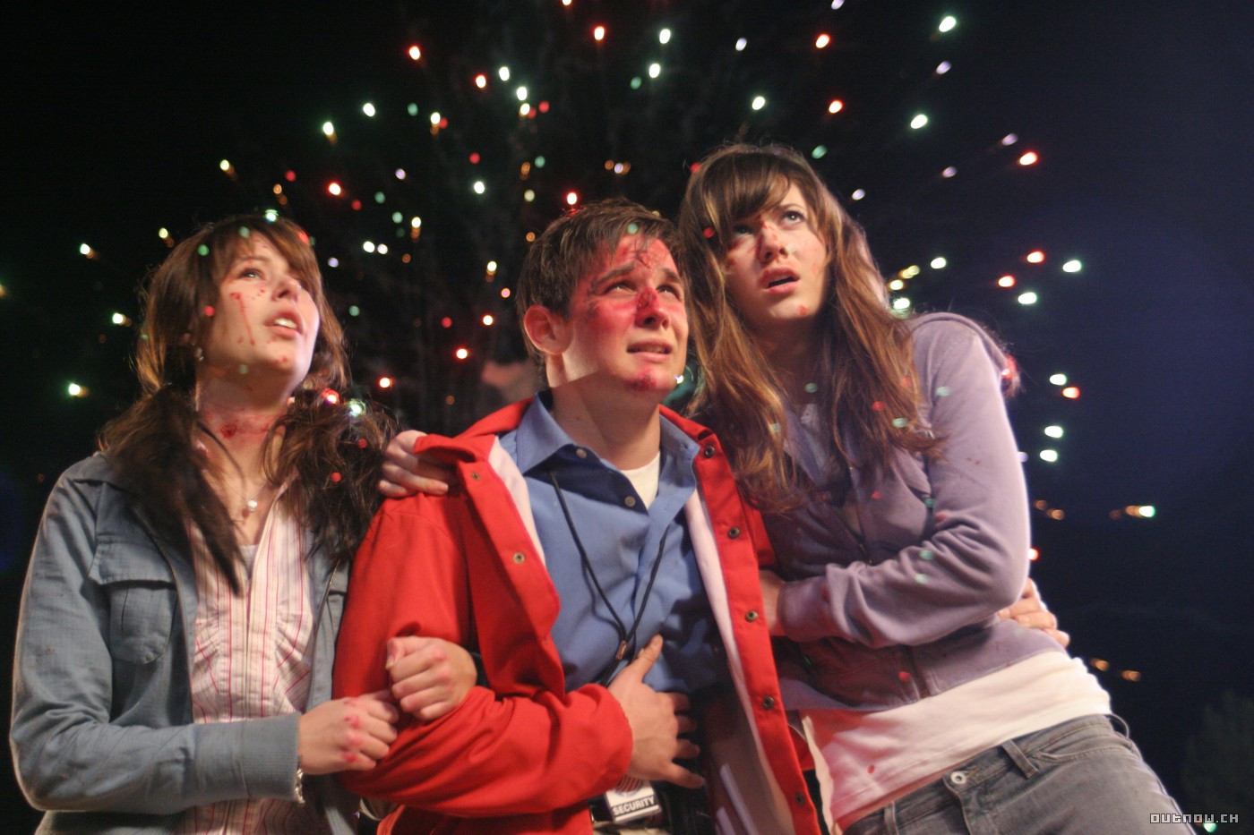 Amanda Crew, Ryan Merriman and Mary Elizabeth Winstead pick themselves up in the aftermath of a rollercoaster accident in Final Destination 3 (2006)