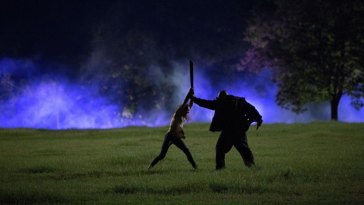 Taissa Farmiga faces down against hockey-masked killer Billy Murphy (Daniel Norris) in The Final Girls (2015)