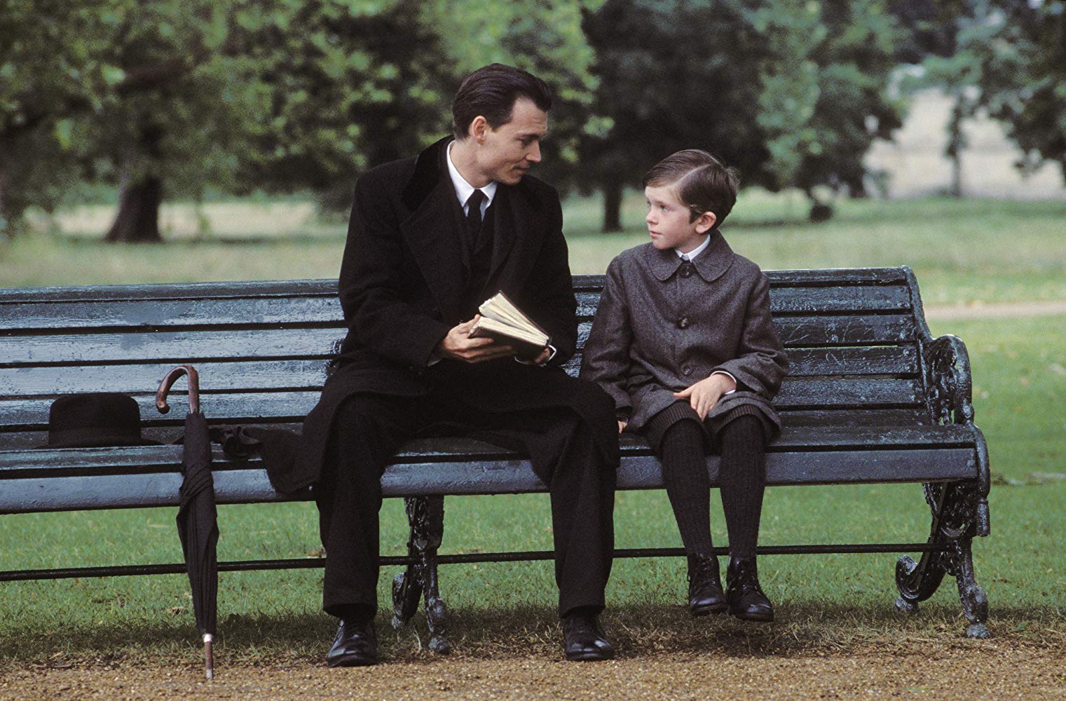 Johnny Depp as J.M. Barrie with Freddie Highmore as Peter Llewelyn Davies in Finding Neverland (2004)