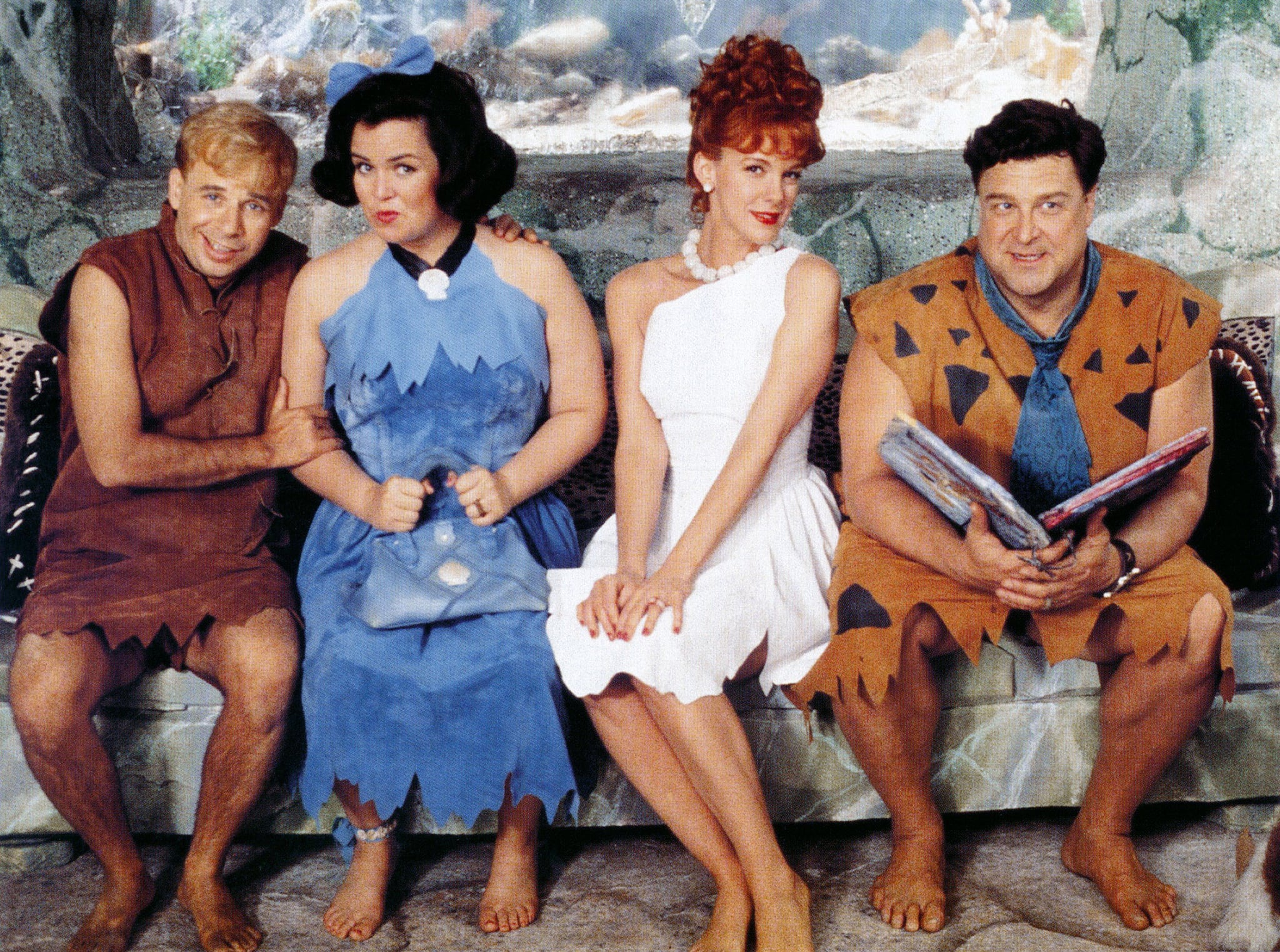 Barney and Betty Rubble (Rick Moranis and Rosie O'Donnell) and Wilma and Fred Flintstone (Elizabeth Perkins and John Goodman) in The Flintstones (1994)