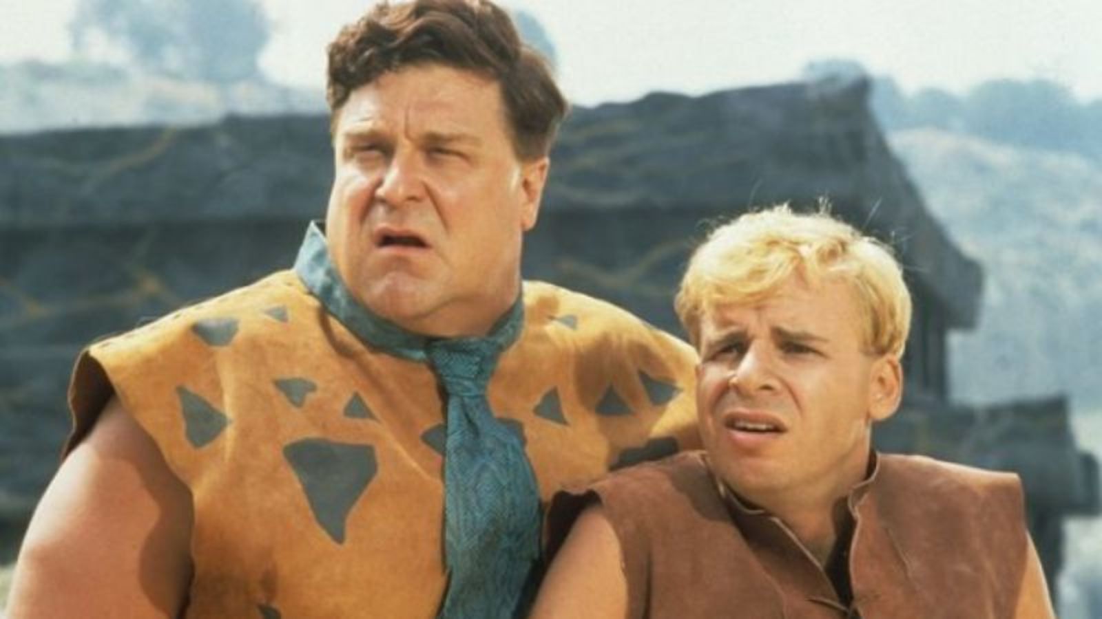 Best friends and co-workers - Fred Flintstone (John Goodman) and Barney Rubble (Rick Moranis) in The Flintstones (1994)