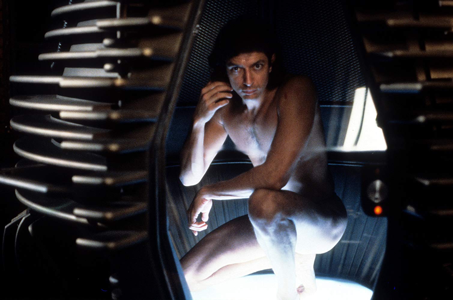 Seth Brundle (Jeff Goldbum) prepares to test out the telepod with himself as a test subject in The Fly (1986)