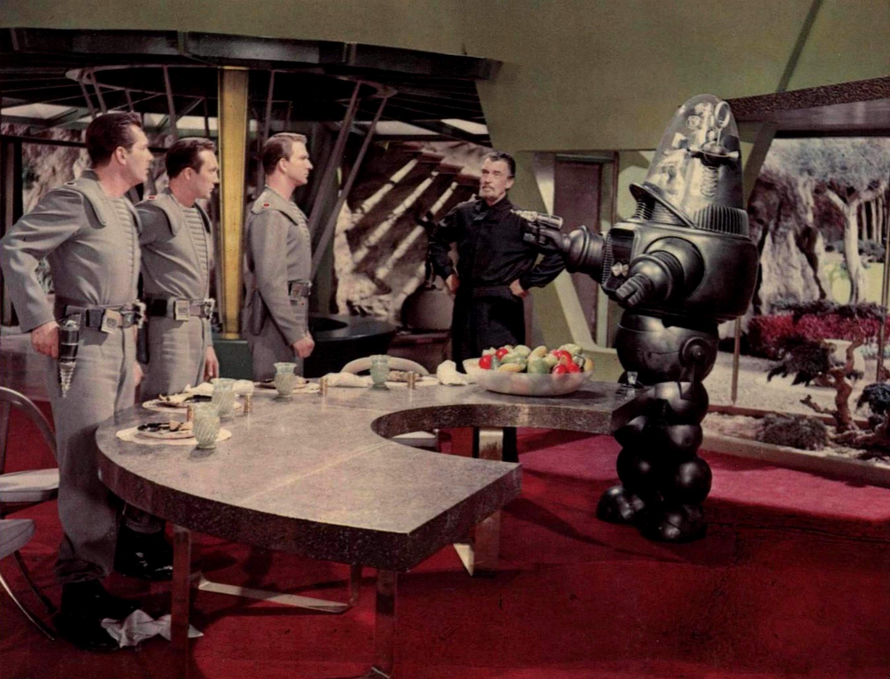 The Earth visitors - Jack Kelly, Warren Stevens, Leslie Nielsen - meet Dr Morbius (Walter Pidgeon) and Robby the Robot in Forbidden Planet (1956)