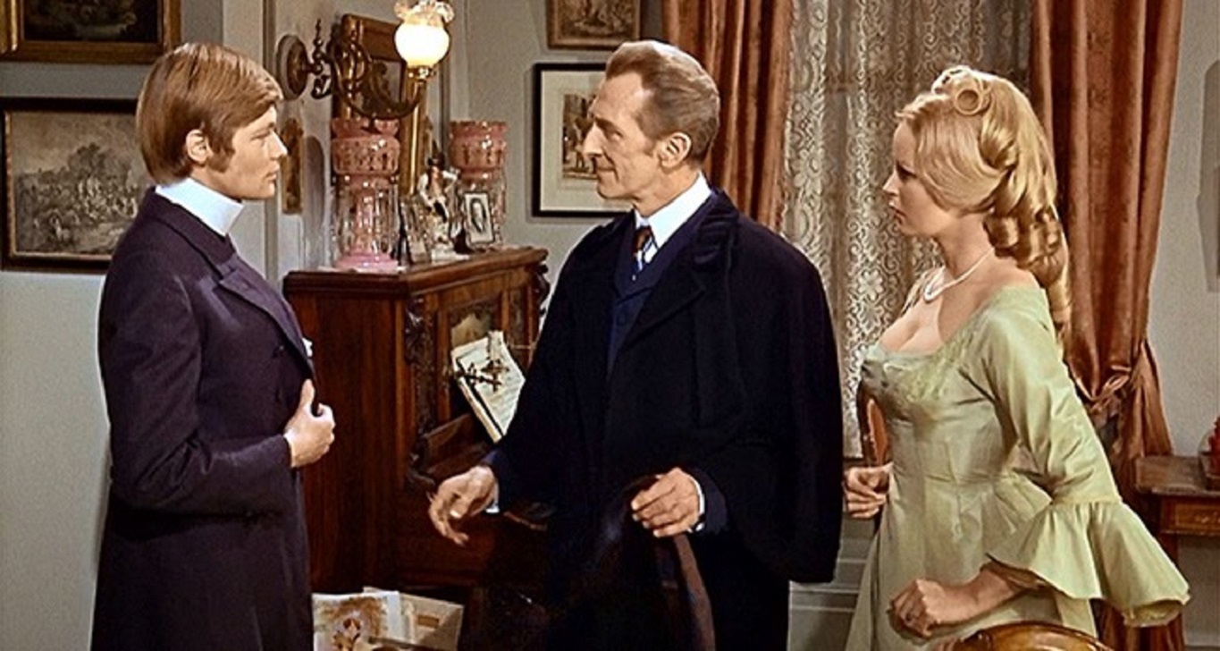 Baron Frankenstein (Peter Cushing) (c) signs in to the boarding house of Veronica Carlson (r) and her fiance Simon Ward (l) in Frankenstein Must Be Destroyed (1969)