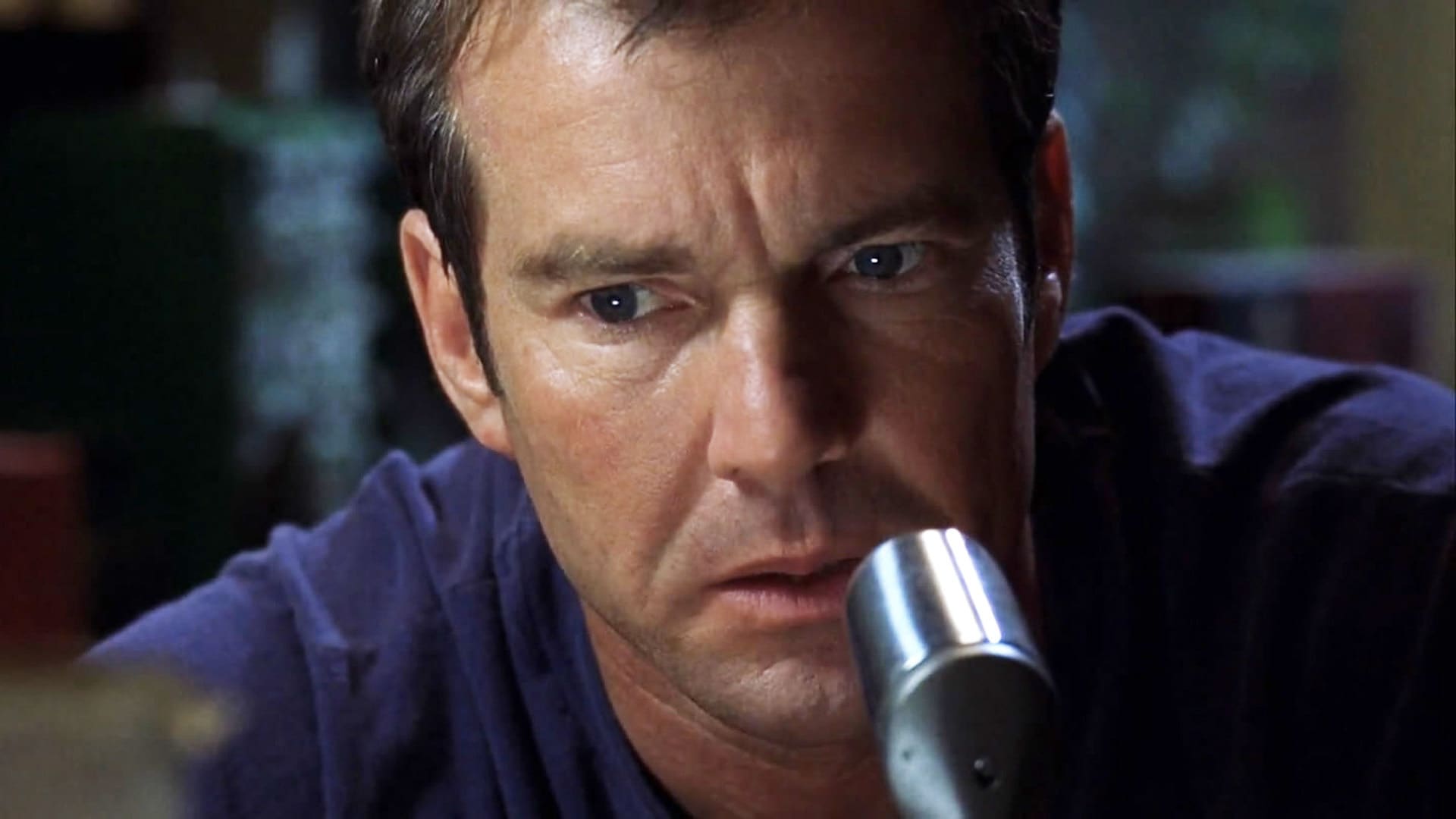 Dennis Quaid communicating by radio in Frequency (2000)