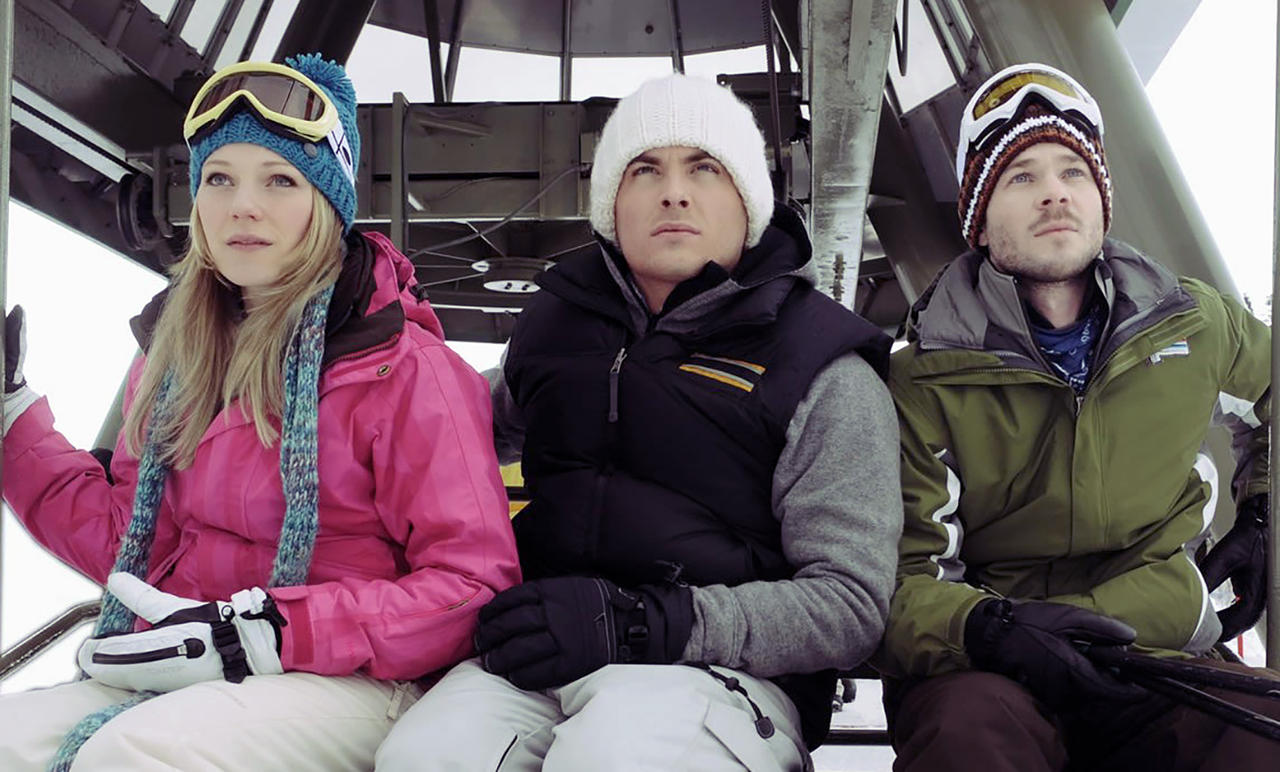 Three friends - (l to r) Emma Bell, Kevein Zegers and Shawn Ashmore - take a ride on a ski chairlift in Frozen (2010)