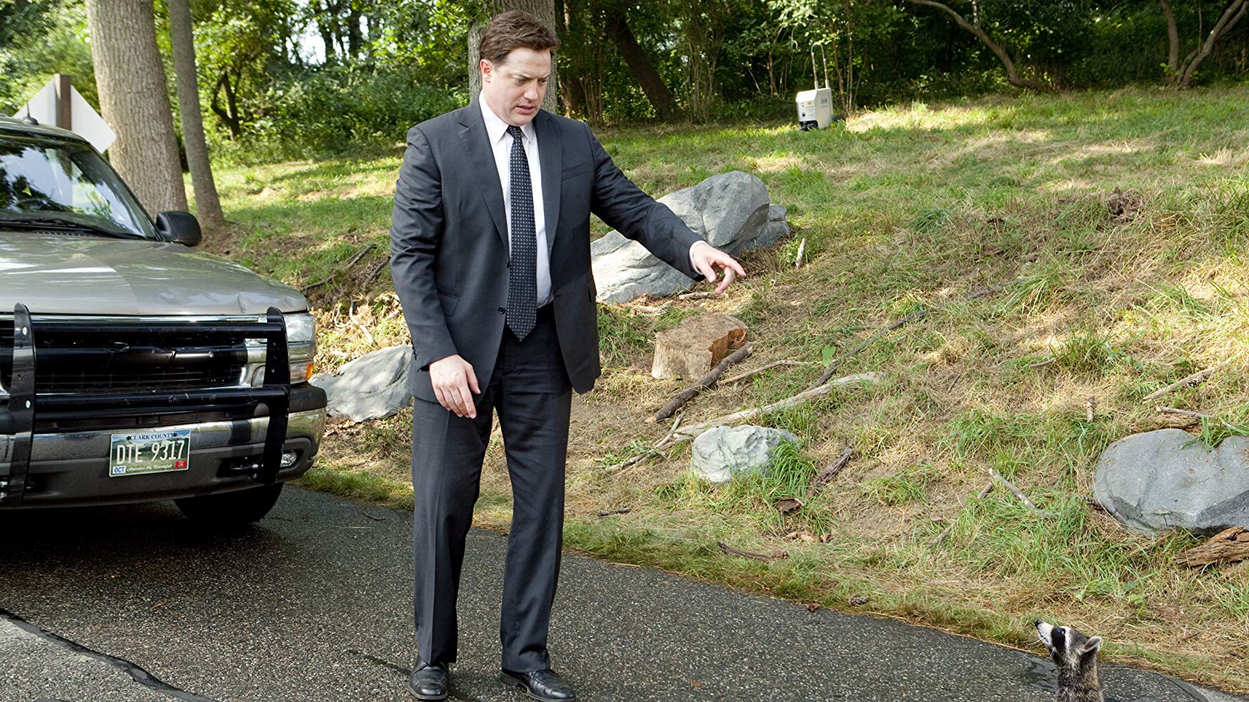 Brendan Fraser and a raccoon in Furry Vengeance (2010)