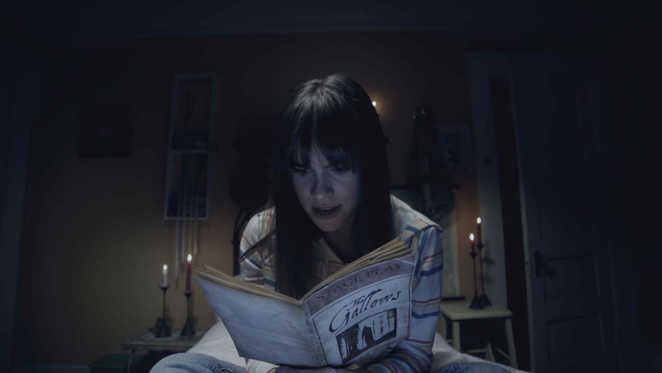 Auna Rue (Ema Horvath) reads a copy of the play in The Gallows Act II (2019)