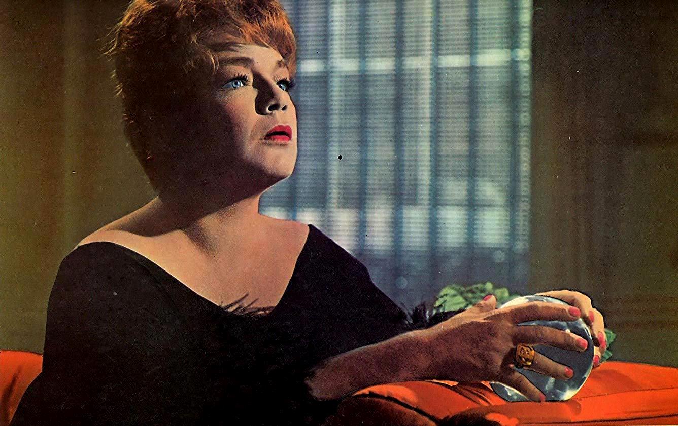 Simone Signoret reads the crystal ball in Games (1967)