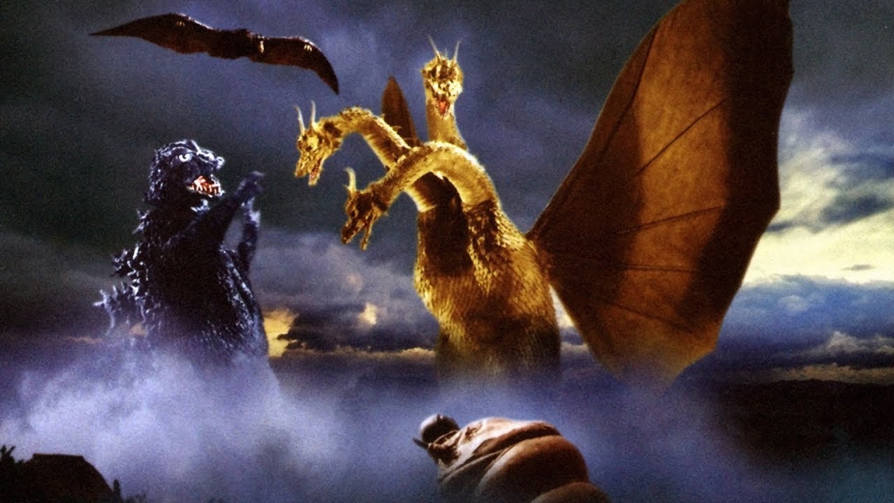 (l to r) Godzilla, Rodan (top) and the larval Mothra (bottom) battle Ghidrah (r) in Ghidrah the Three-Headed Monster (1964)