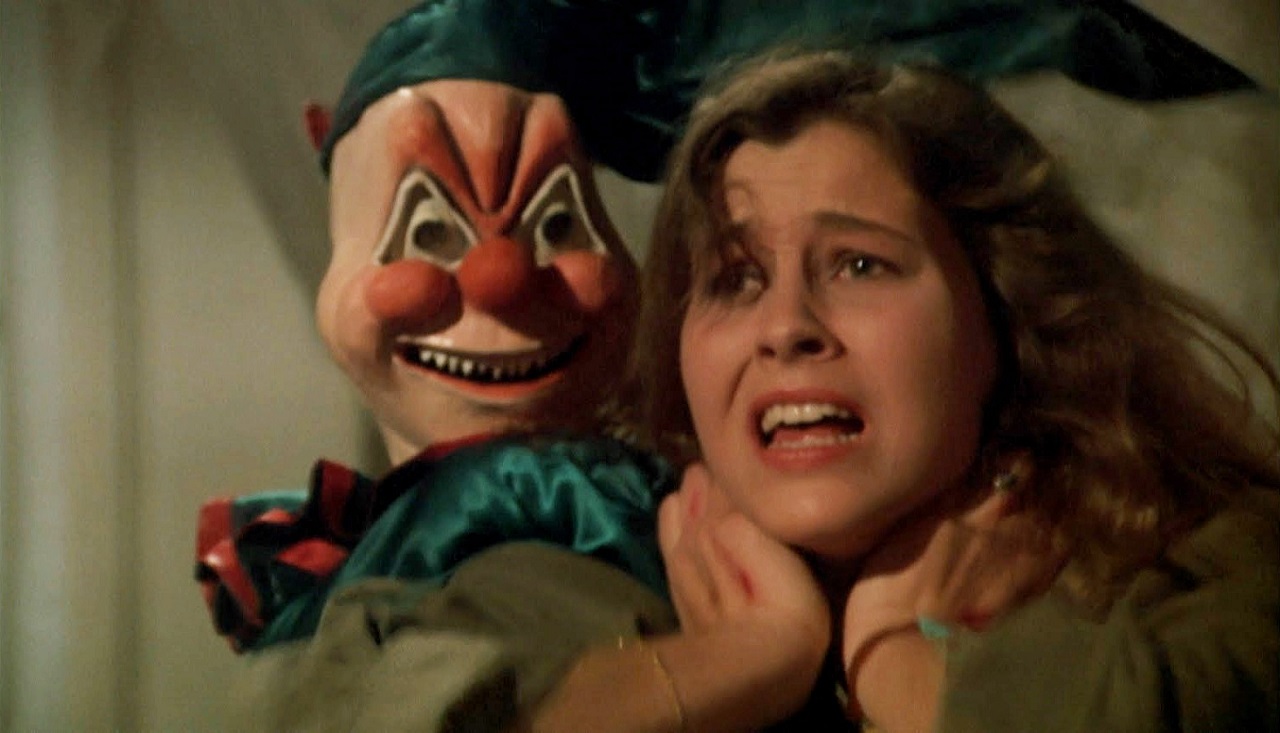 Lara Wendel attacked by the evil doll in Ghosthouse (1988)