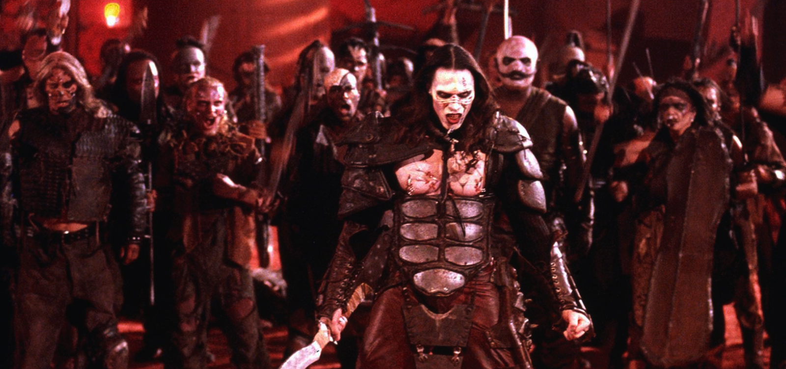 Colonists possessed by the spirits of the Martian dead gather in Ghosts of Mars (2001)