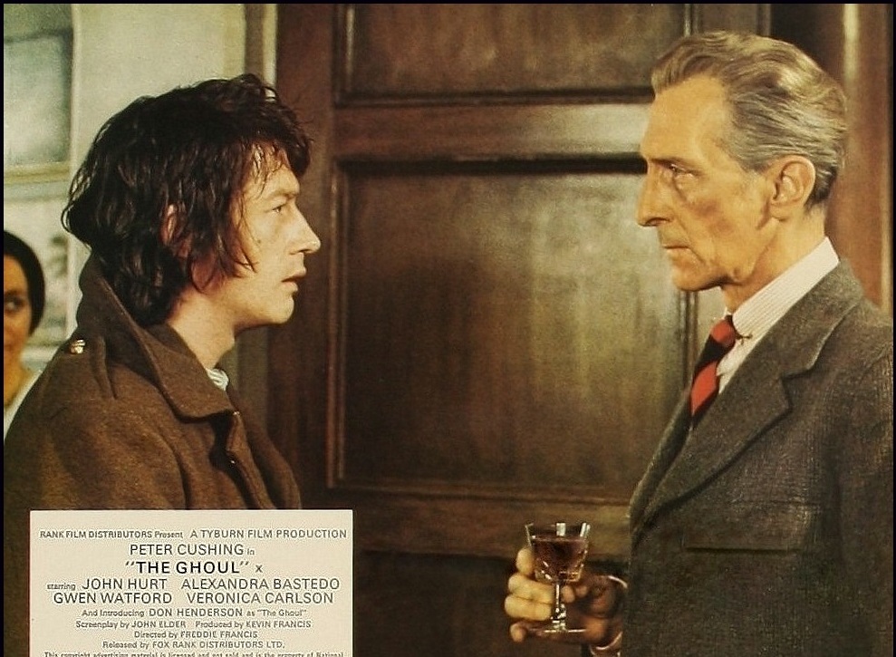 (l to r) A young John Hurt as Tom Rawlings and Peter Cushing as Dr Lawrence in The Ghoul (1975)