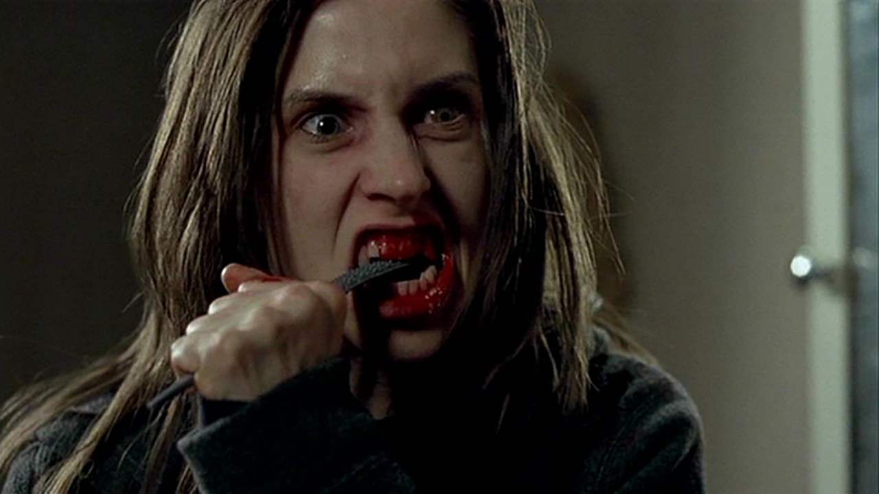 Emily Perkins tries to stop the emergence of the werewolf by filing her teeth down in Ginger Snaps: Unleashed (2004)