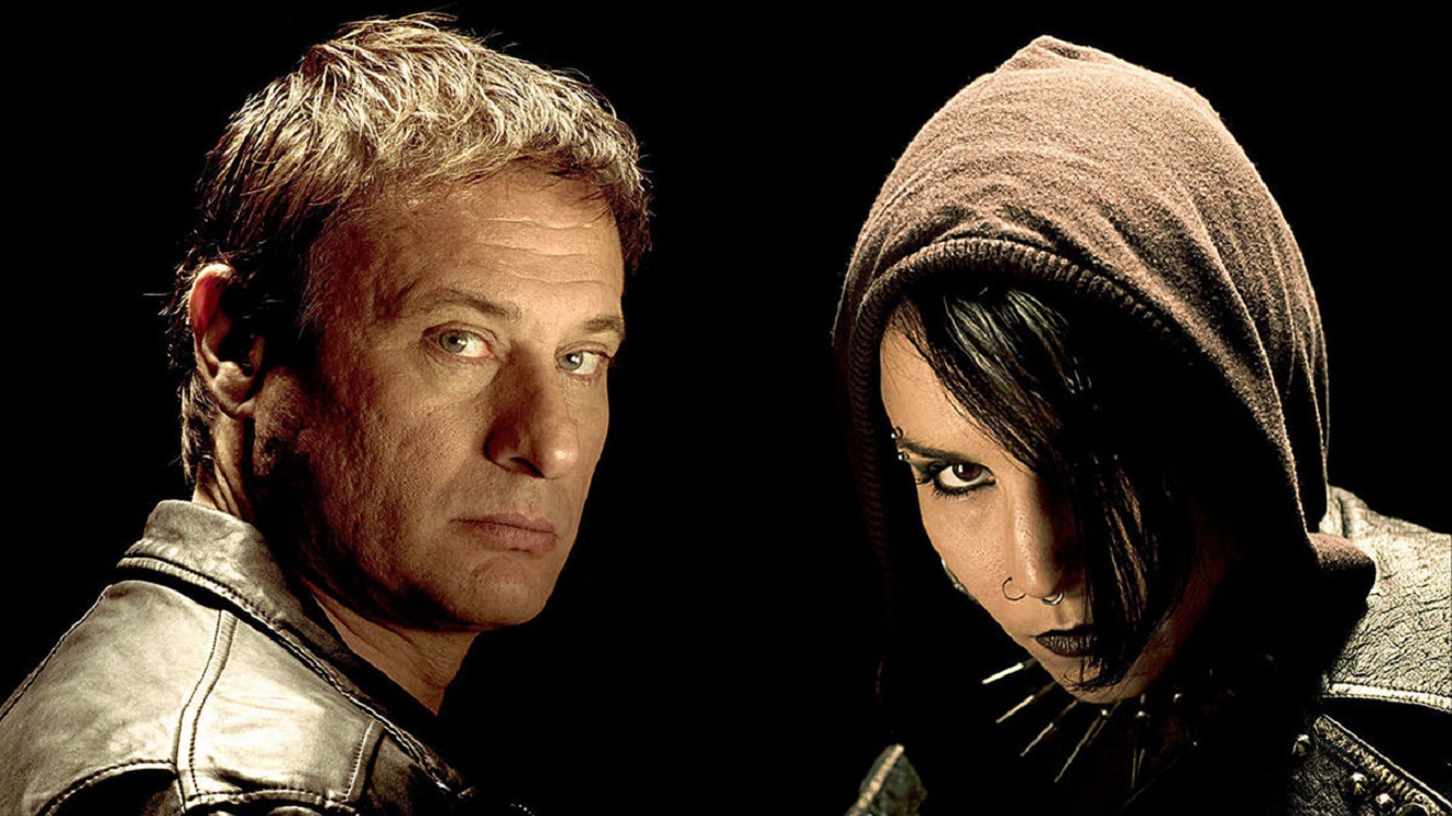 The protagonists of the Millennium trilogy - Michael Nyqvist as Mikael Blomkvist, editor of Millennium magazine, and Noomi Rapace as outlaw hacker Lisbeth Salander in The Girl with the Dragon Tattoo (2009)