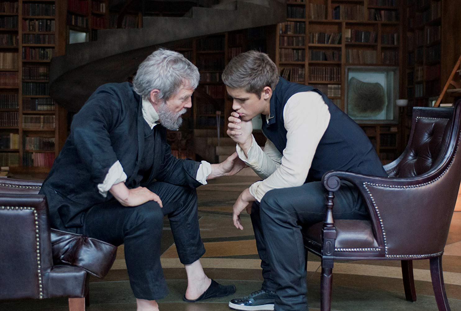 The Giver (Jeff Bridges) instructs Jonas (Brenton Thwaites) in the ways of the past in The Giver (2014)