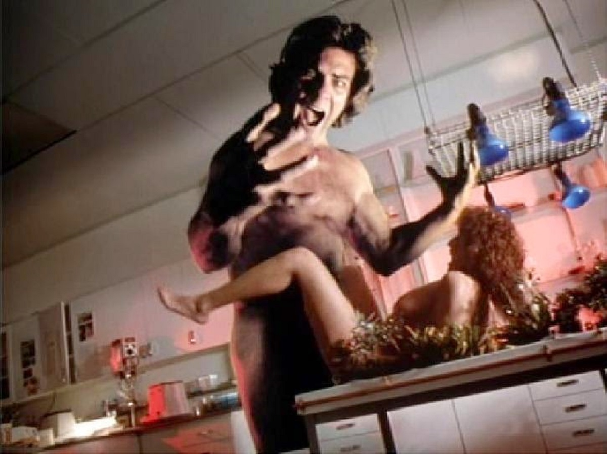 A giant Paul Coufos with Kimberly Dickson in Gnaw: Food of the Gods II (1989)