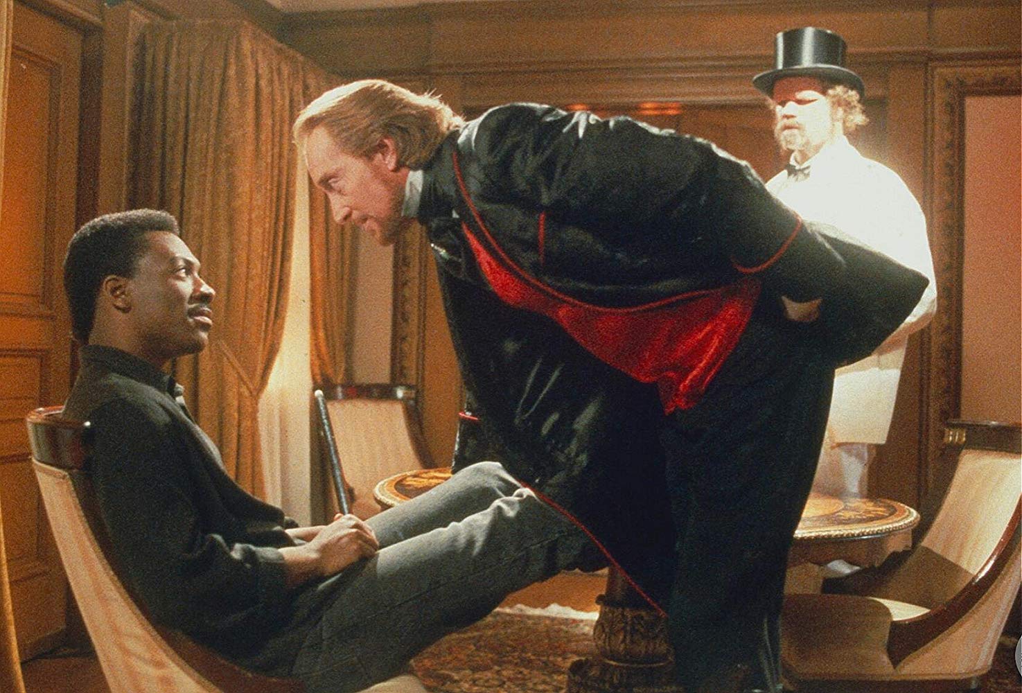 (l to r) Eddie Murphy with Charles Dance as the demonic Sardo Numspa in The Golden Child (1986)