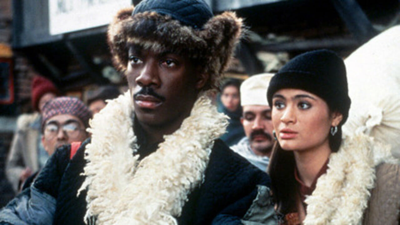 Edde Murphy as social worker Chandler Jarrell and Charlotte Lewis as the Tibetan envoy in The Golden Child (1986)