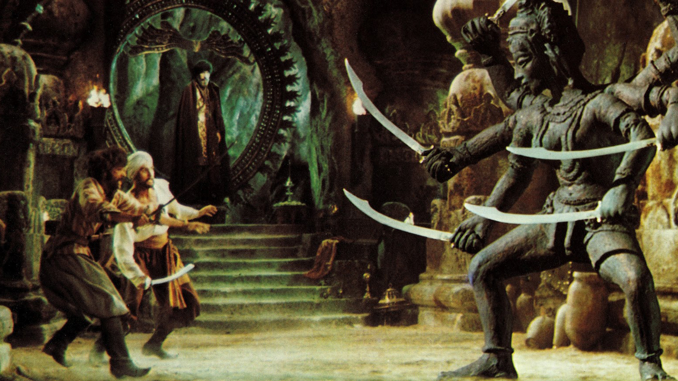 Sinbad (John Philip Law) and men fight the statue of Kali brought to life by the sorcerer Koura (Tom Baker) in The Golden Voyage of Sinbad (1973)