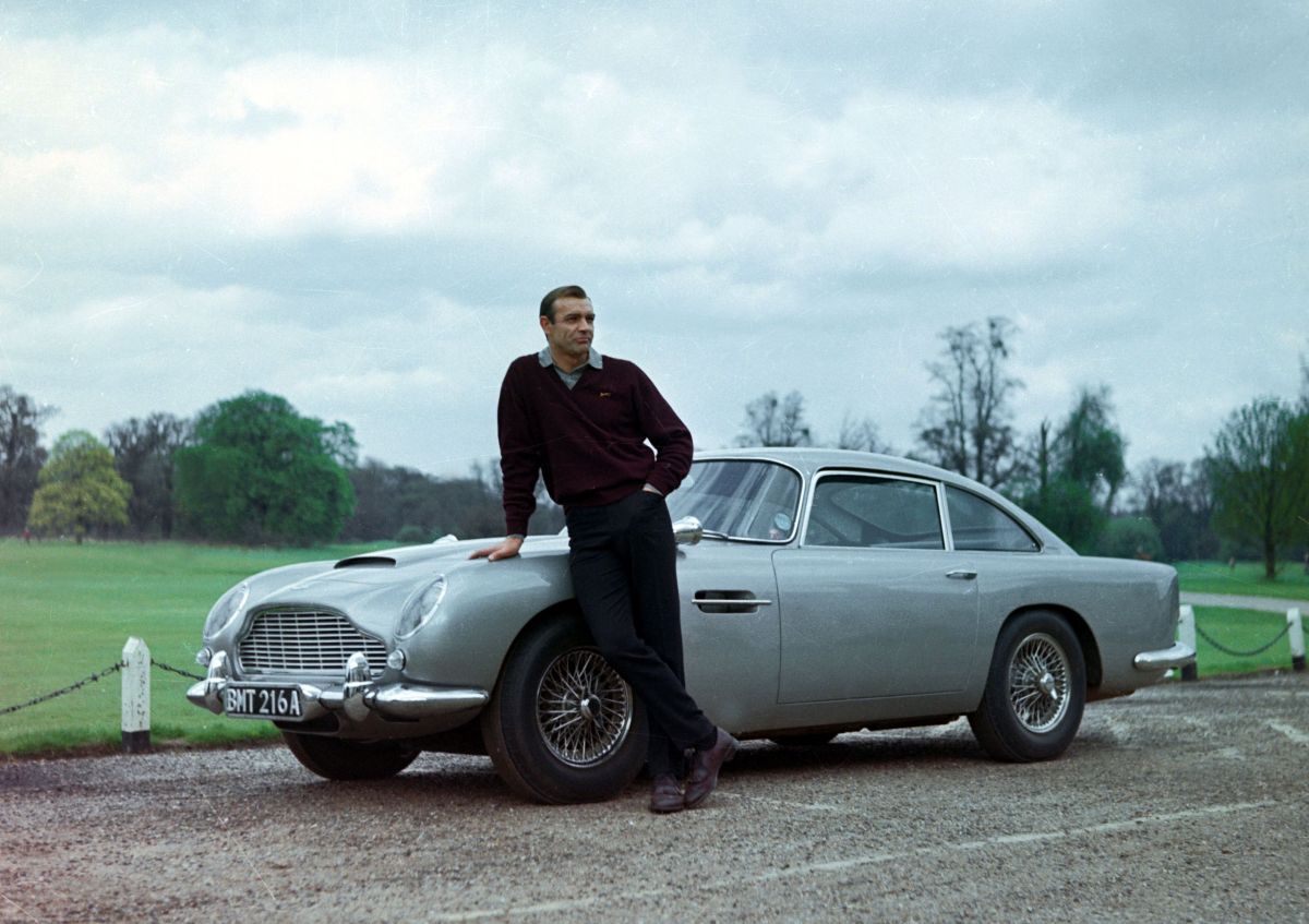 Sean Connery as James Bond with the classic Bond car The Aston Martin DB5 in Goldfinger (1964)