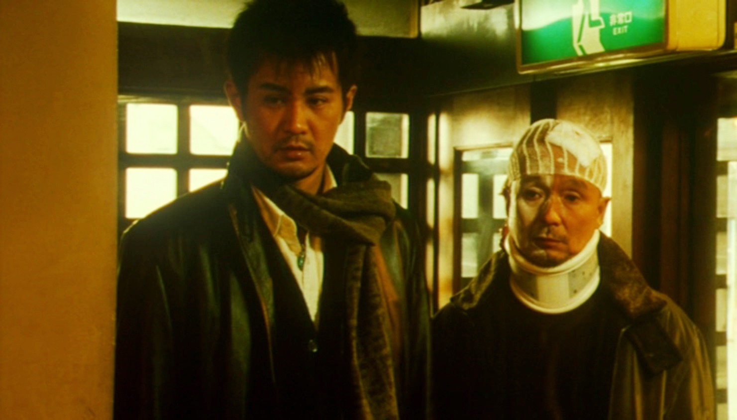 (l to r) Hideki Sone on a quest for his missing brother and Harumi Sone as the battered medium in Gozu (2003)