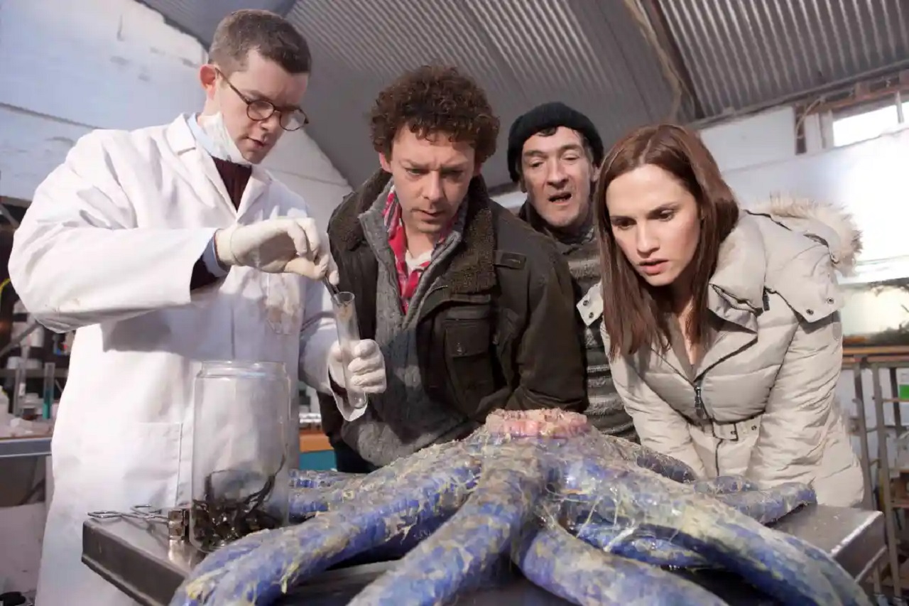 Russell Tovey, Richard Coyle, Lalor Roddy and Ruth Bradley examine an alien creature in Grabbers (2012)