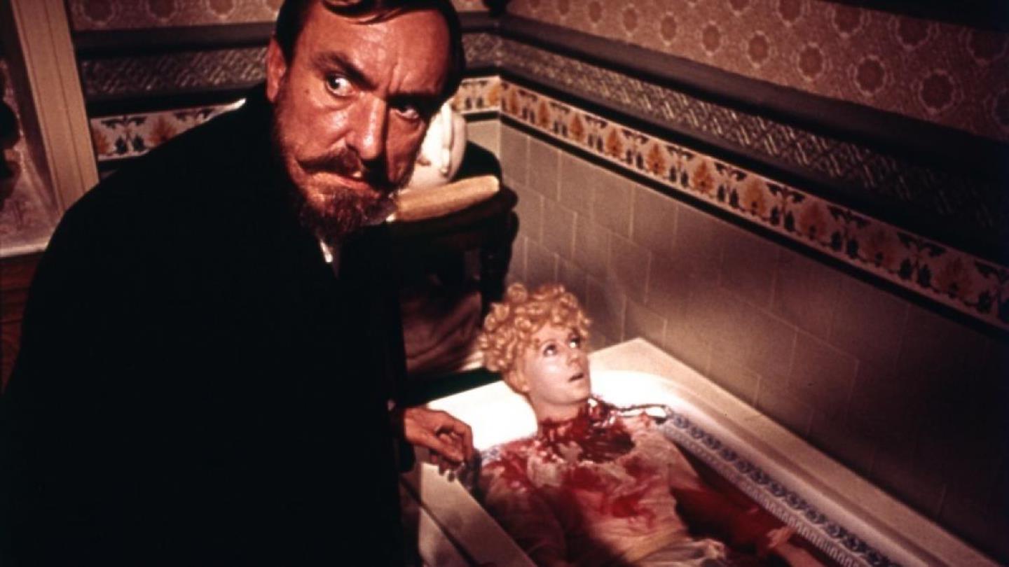 Eric Porter discovers a murdered body in the bath in Hands of the Ripper (1971)