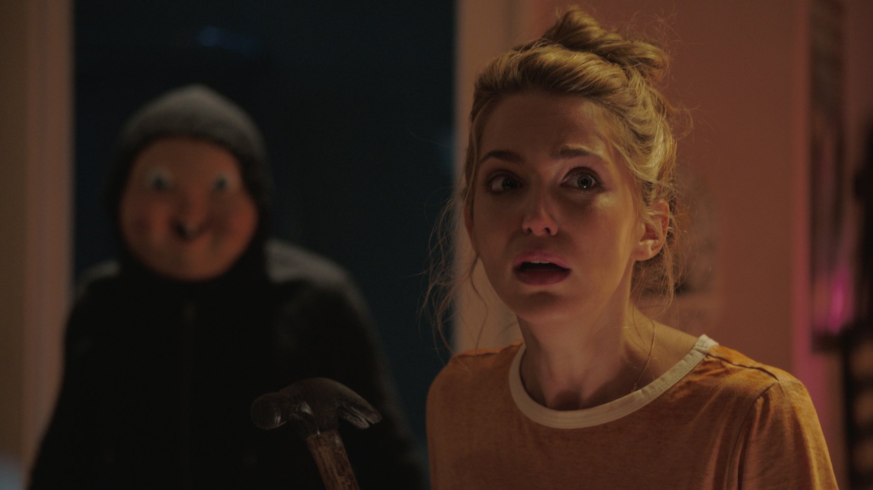 Jessica Rothe and masked killer in Happy Death Day (2017)