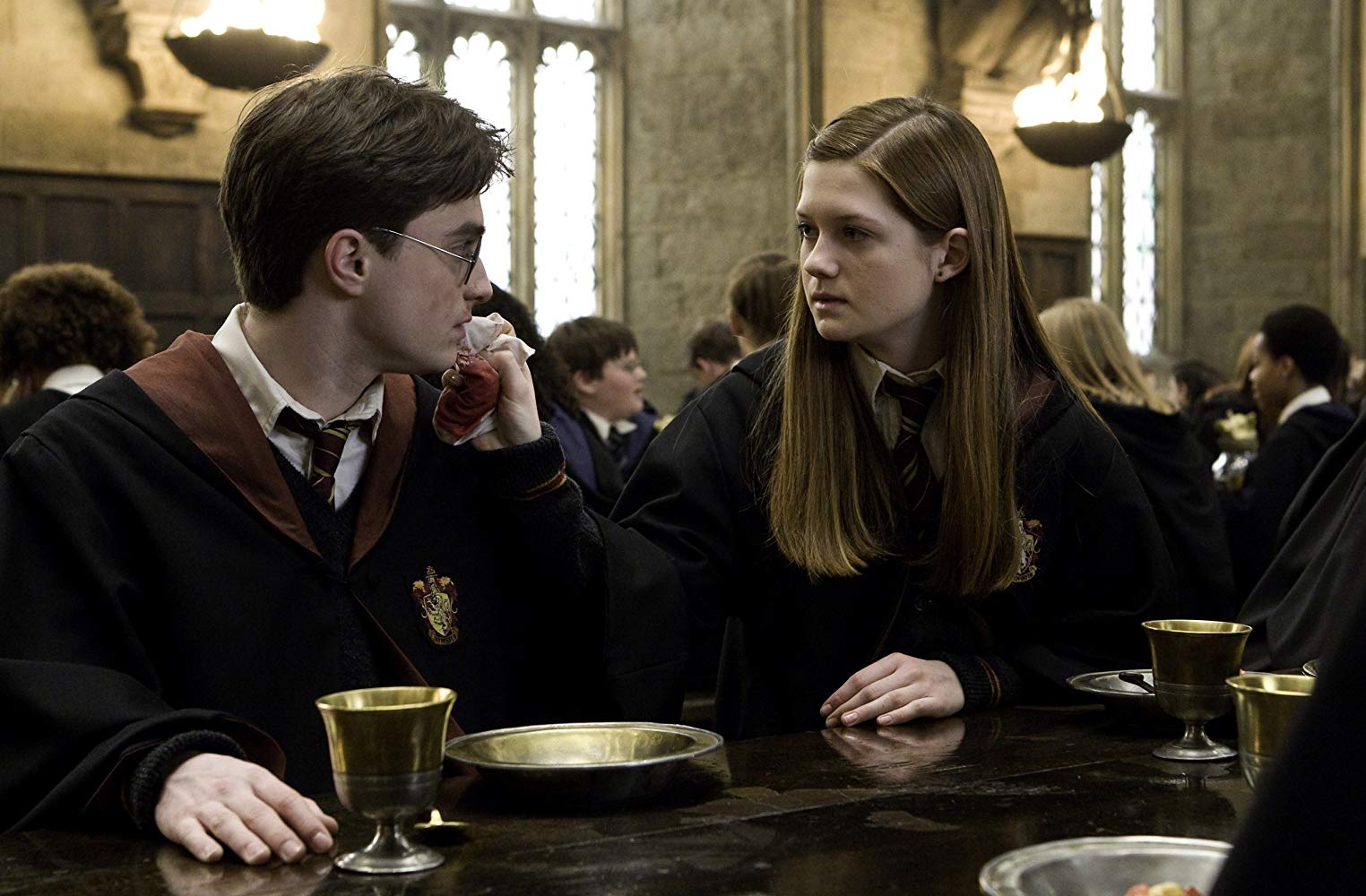 Growing attraction between Harry Potter (Daniel Radcliffe) and Ginny Weasley (Bonnie Wright) in Harry Potter and the Half-Blood Prince (2009)