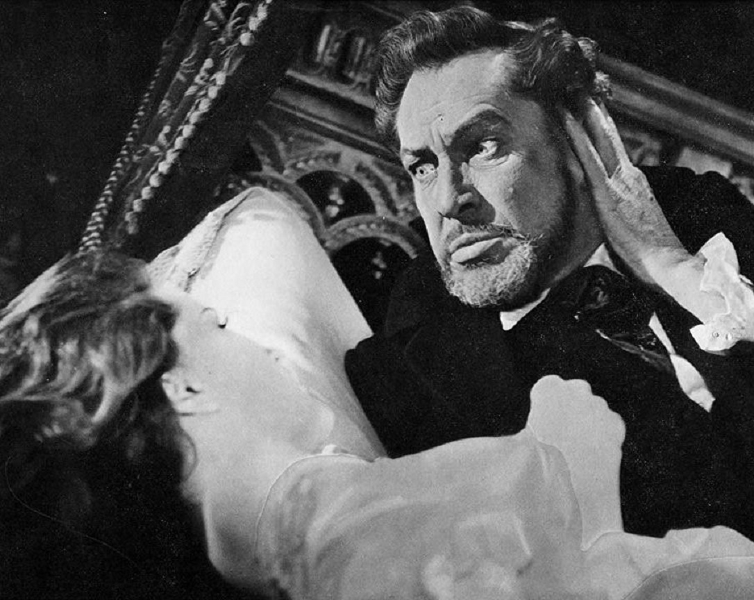 A possessed Charles Dexter Ward (Vincent Price) menaces Debra Paget in The Haunted Palace (1963)