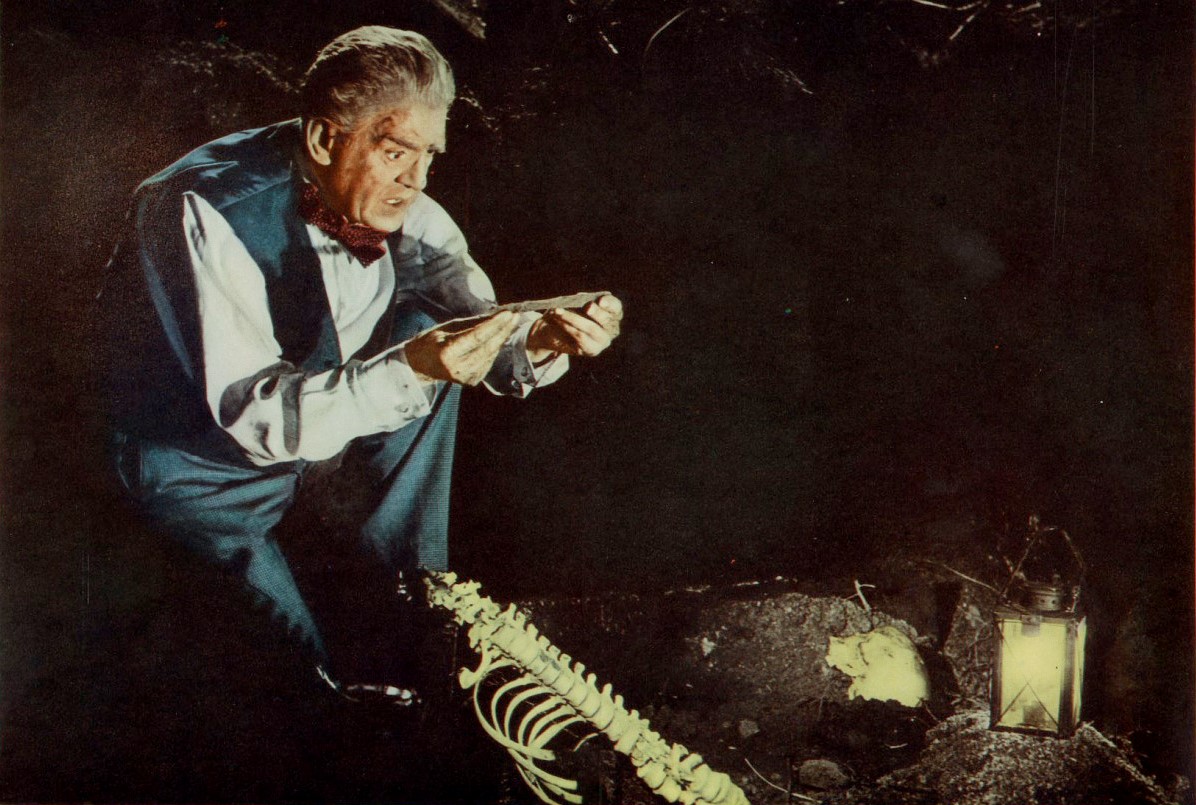 James Rankin (Boris Karloff) opens the grave of the Haymarket Strangler to find his knife in The Haunted Strangler (1958)