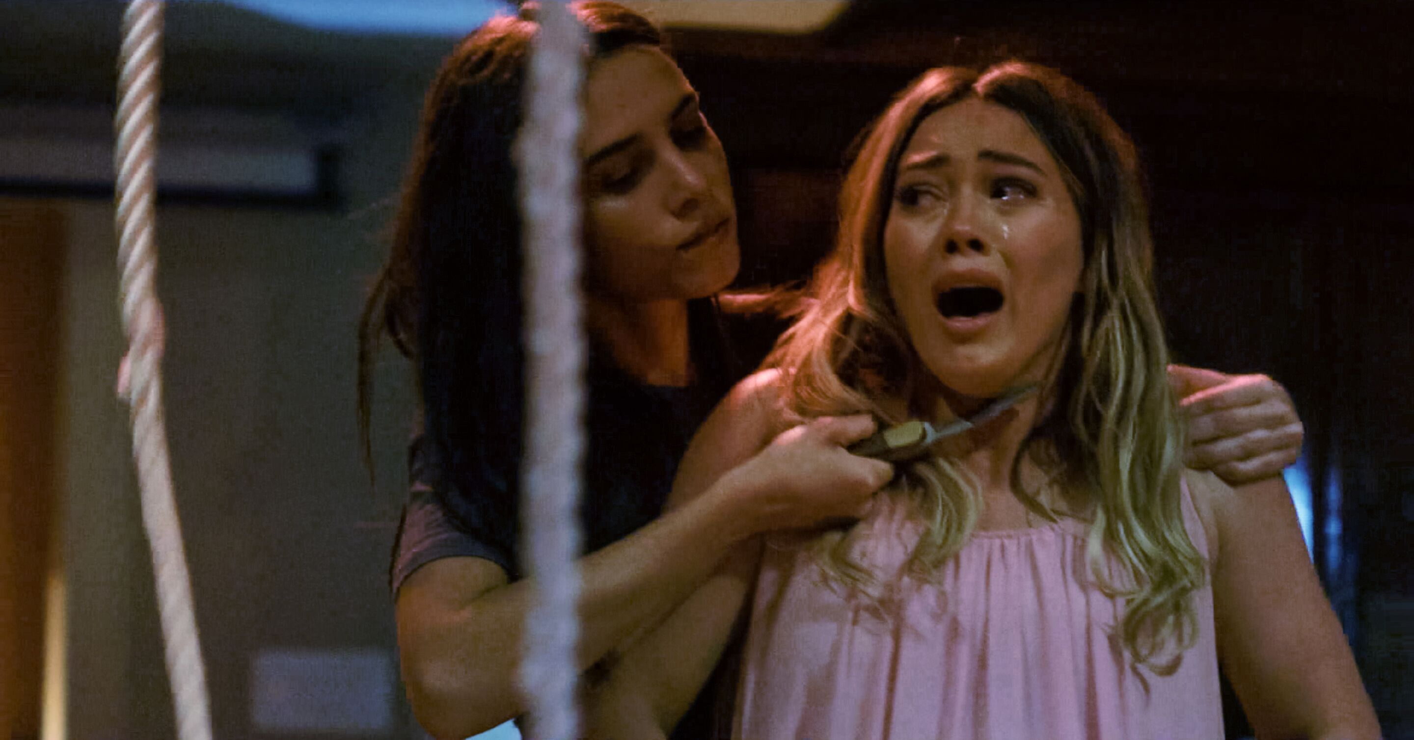 Sharon Tate (Hilary Duff) under attack by one of the members of Charles Manson's Family in The Haunting of Sharon Tate (2019)