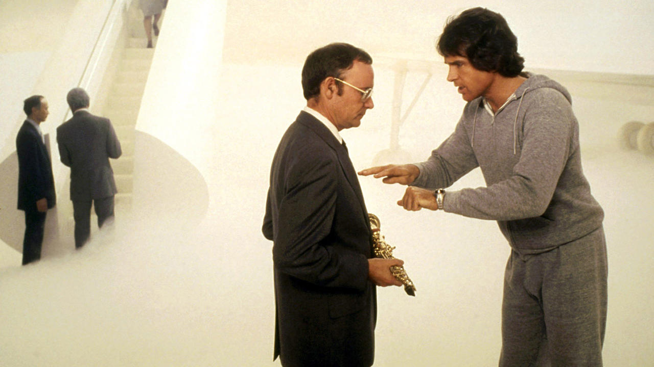 Joe Pendleton (Warren Beatty) argues with The Escort (co-director Buck Henry) in the afterlife in Heaven Can Wait (1978)