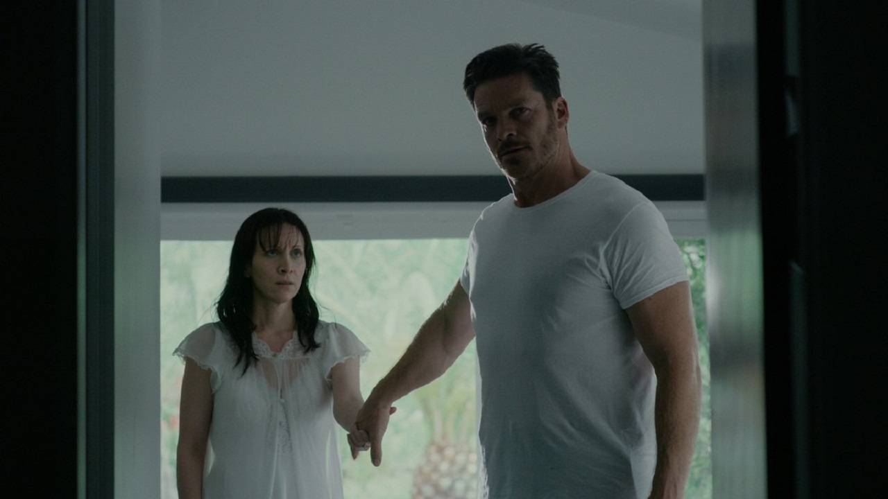 Imprisoned husband and wife Bart Johnson and Jill Awbrey in Held (2020)