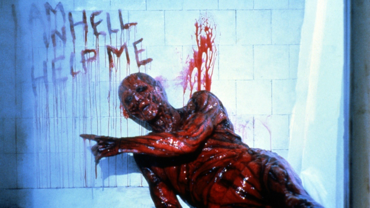 Kristy receives a vision of her father (Oliver Smith) suffering in Hell in Hellbound: Hellraiser II (1988)