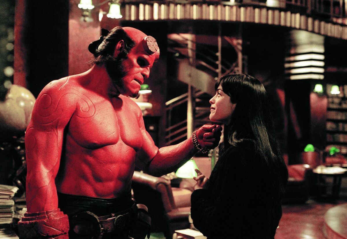 Hellboy (Ron Perlman) and Liz Sherman (Selma Blair) in Hellboy (2004)