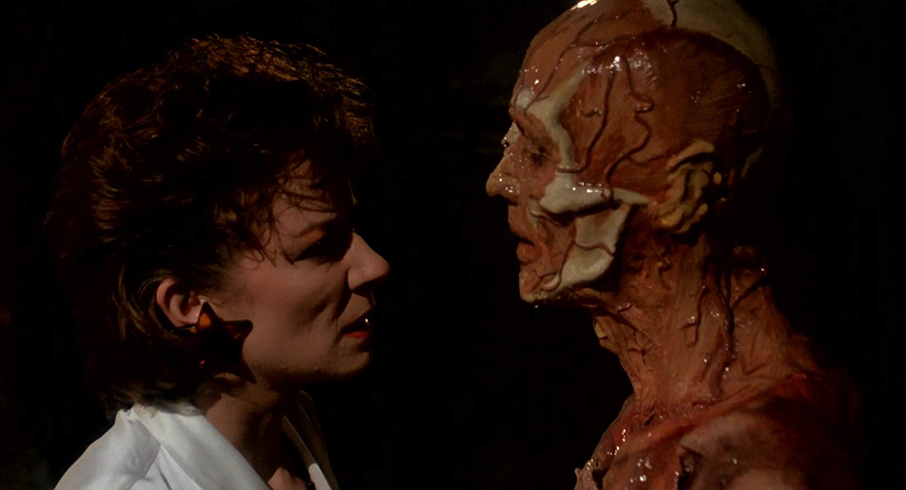 Clare Higgins and the skinless Frank (Oliver Smith) in Hellraiser (1987)