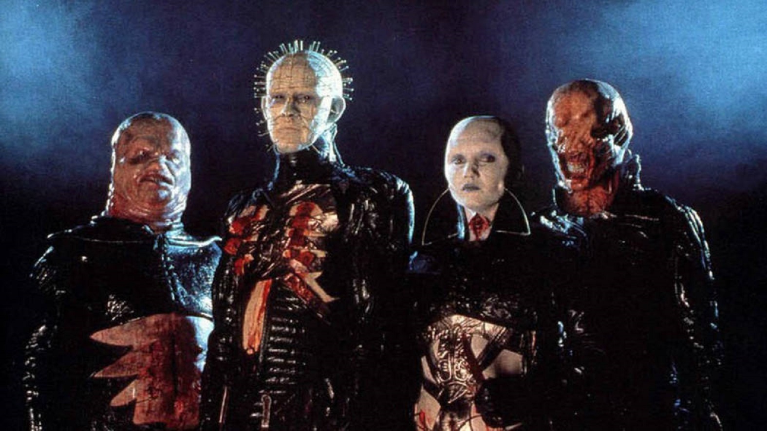 The Cenobites - Butterball (Simon Bamford), Pinhead (Doug Bradley), the female Cenobite (Grace Kirby) and Chatterer (Nicholas Vince) - in Hellraiser (1987)