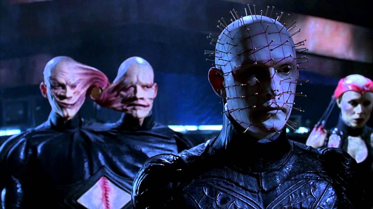 (l to r) The Twins (real-life twins and later directors Mark and Michael Polish), Pinhead (Doug Bradley) and Angelique (Valentina Vargas) in Hellraiser: Bloodline (1996)