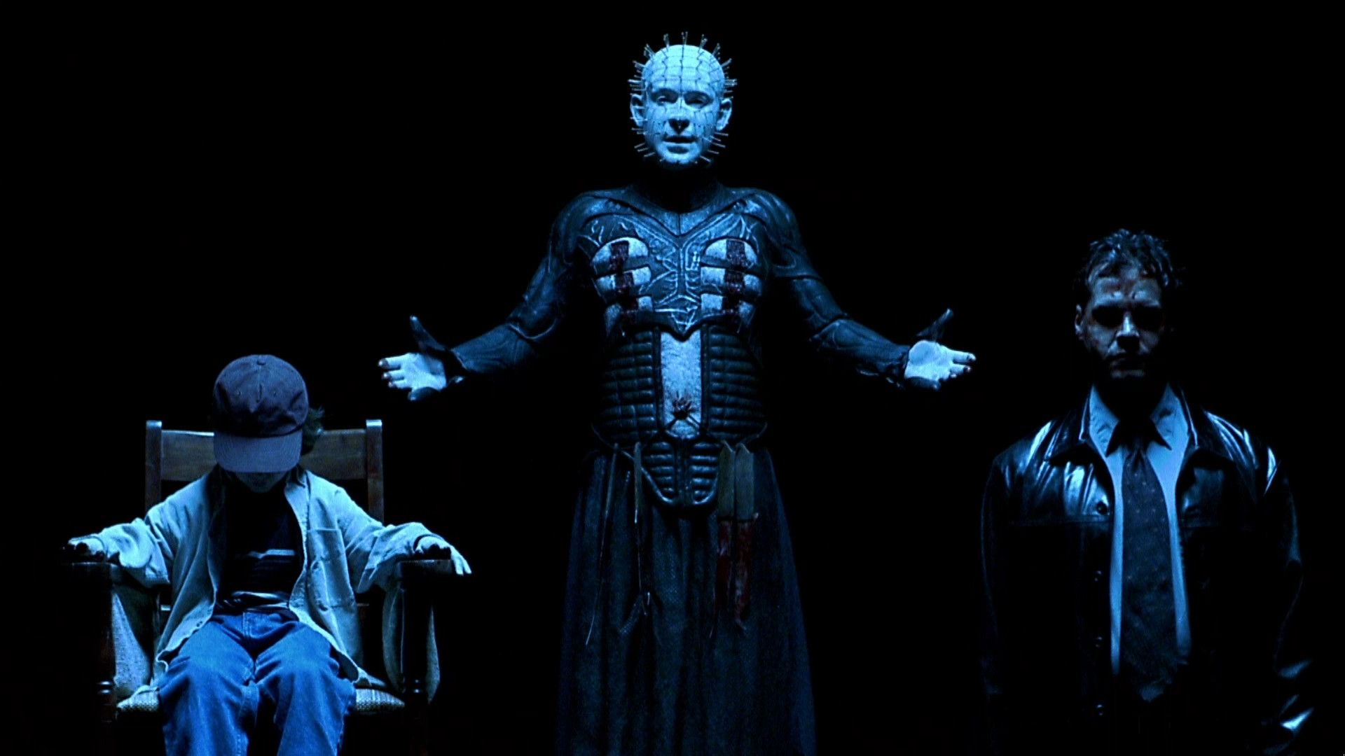 Pinhead (Doug Bradley) (c) with J.B Gaynor (l) and Craig Sheffer (r) held prisoner in Hellraiser: Inferno (2000)