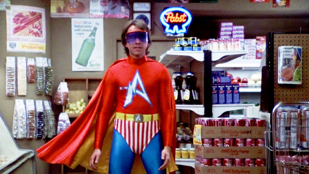 John Ritter as Captain Avenger in Hero at Large (1980)