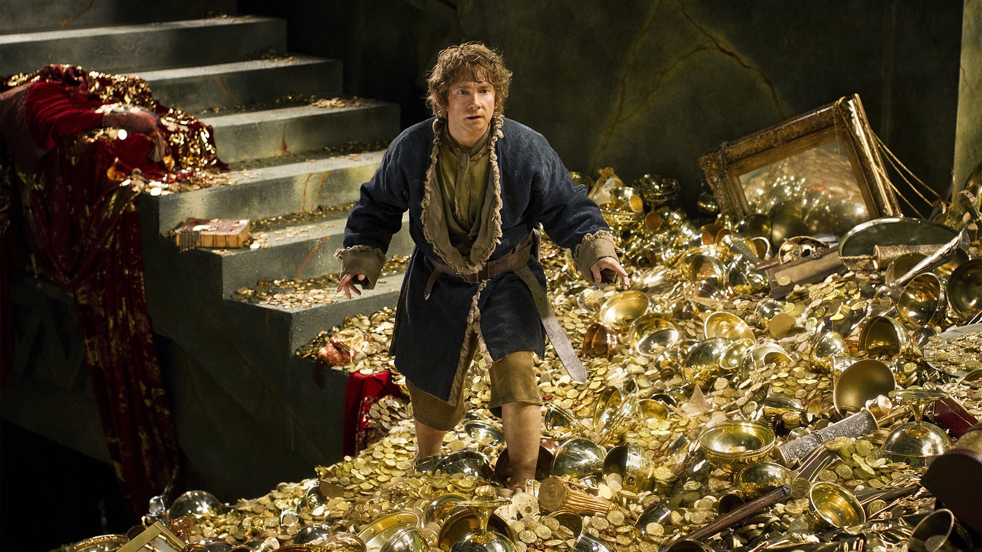 Bilbo Baggins (Martin Freeman) enters into the Lonely Mountain and dragon's cave in The Hobbit: The Desolation of Smaug (2013)