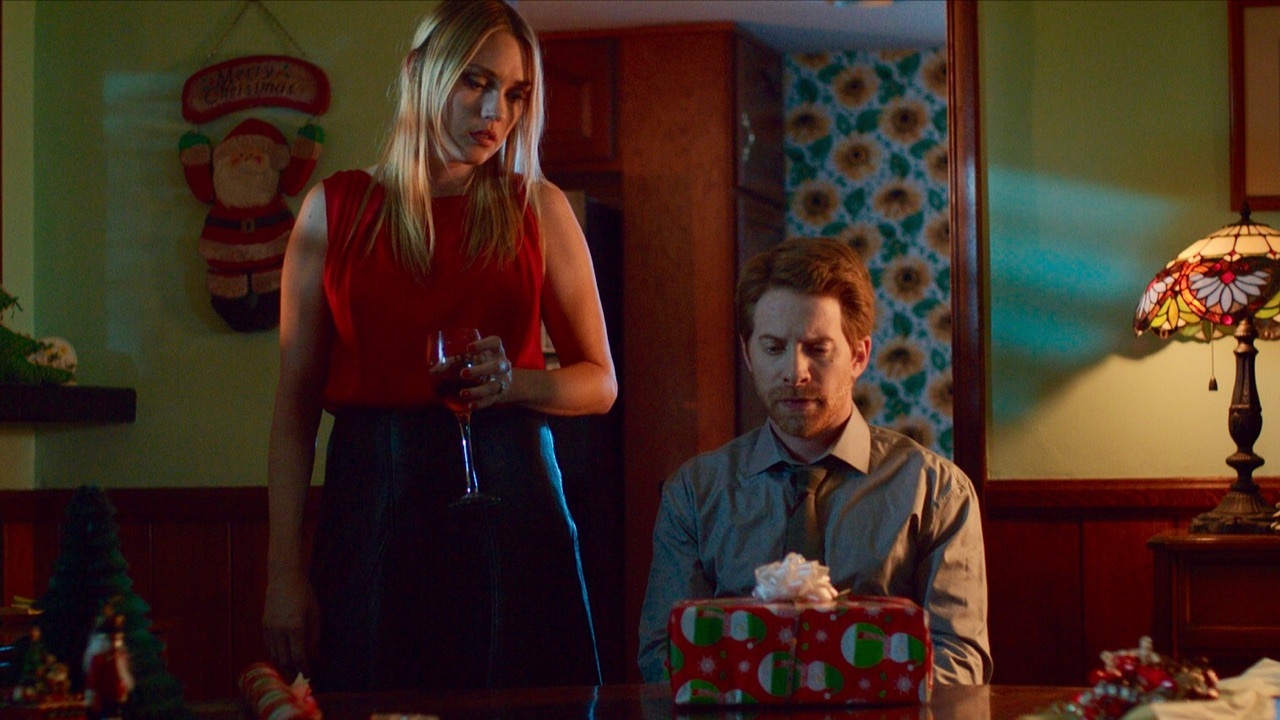 Parents Clare Grant and Seth Green prepare the Christmas present in the Christmas episode of Holidays (2016)