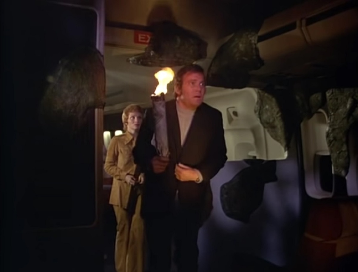 William Shatner and Lynn Loring face druidic stone on an airplane in The Horror at 37,000 Feet (1973)