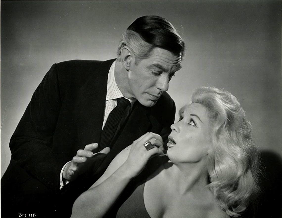 Crime writer Edmond Bancroft (Michael Gough) torments June Cunningham in Horrors of the Black Museum (1959)